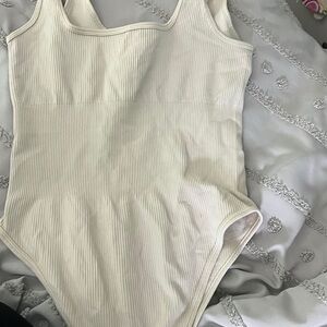 Cream Bodysuit with Scoop Neckline and Textured Fabric